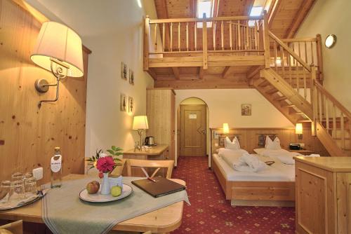 En eller flere senge i et værelse på Hotel Neuhäusl Superior