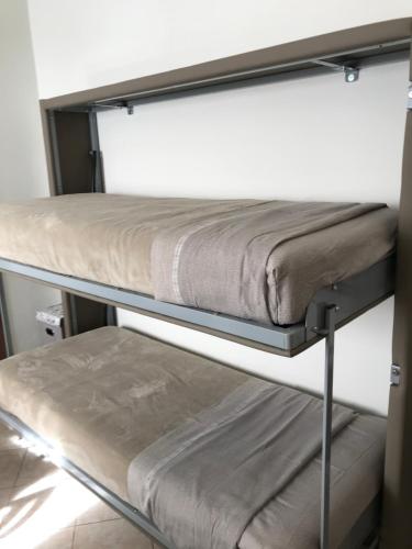 Двухъярусная кровать или двухъярусные кровати в номере Casamina