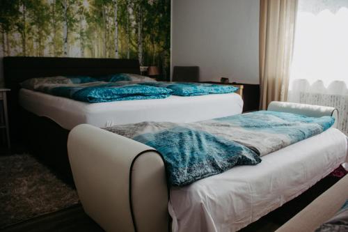 Кровать или кровати в номере Pension Leprich