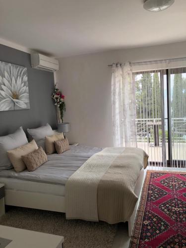 a bedroom with a large bed and a window at Villa Maja in Njivice
