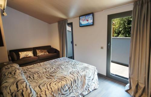 Voodi või voodid majutusasutuse Hotel 9 Sant Antoni toas