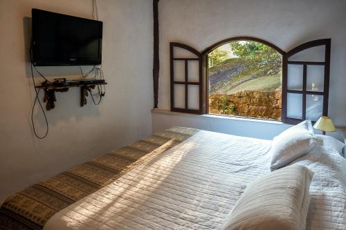 Кровать или кровати в номере Pousada Paraíso Açú