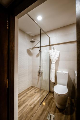 a bathroom with a toilet and a shower at MAZMI CASA in Dubai