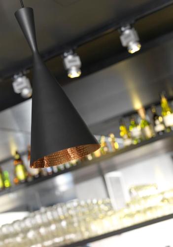 a black lamp hanging above a computer keyboard at Best Western Princess Hotel in Norrköping