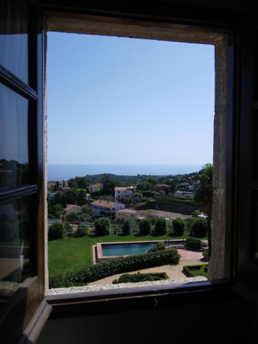 a window with a view of a yard at Can Mora de Dalt in Sant Vicenç de Montalt