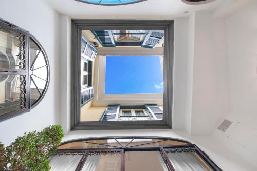 a window in a building with a view of the sky at Palazzo Marziale in Sorrento