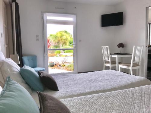 Ένα ή περισσότερα κρεβάτια σε δωμάτιο στο Les sables