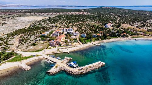 an aerial view of a resort on a beach at Boutique Villa Nirvana in Pag