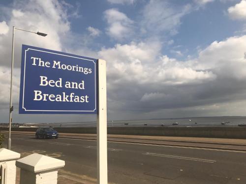 a blue sign on the side of a road at The Moorings B&B in Southend-on-Sea