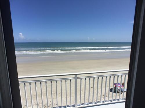 a view of the beach from a balcony at Coastal Waters in New Smyrna Beach