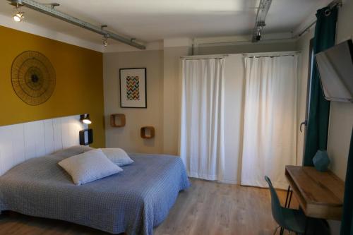 Postel nebo postele na pokoji v ubytování Le Sommeil des Fées