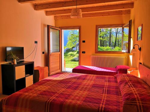 Katil atau katil-katil dalam bilik di Agriturismo Val Codera