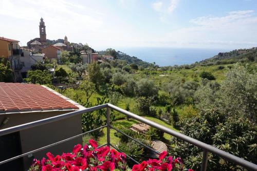 a view of the ocean from the balcony of a house at I Valloni Apartments in Imperia