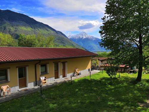a house with a view of a mountain at Agriturismo Val Codera in Verceia