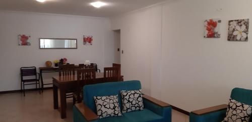 a dining room with a table and chairs at Las Palmeras in Santa Cruz de la Sierra