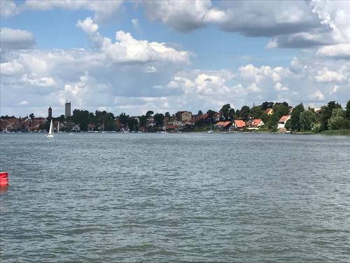 a large body of water with a sail boat in it at Przytulisko na Mazurach in Ruciane-Nida