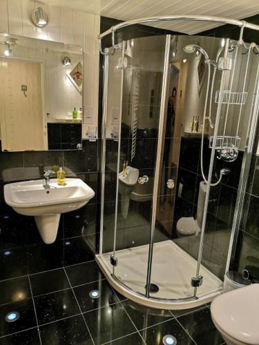 a bathroom with a shower and a sink at Samphire in Padstow