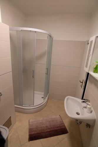 a bathroom with a shower and a sink at Volcano Rijeka in Rijeka