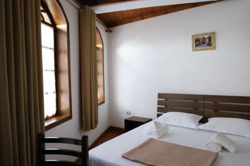 Postel nebo postele na pokoji v ubytování Hotel Demaj