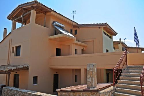 a building with stairs in front of it at Villa Eugenia in Theológos