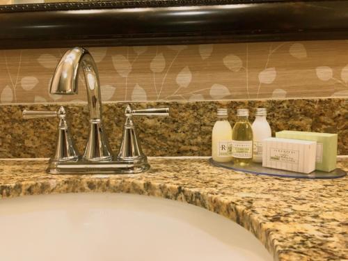 a sink in a bathroom with a counter top at Singing Hills Golf Resort at Sycuan in El Cajon
