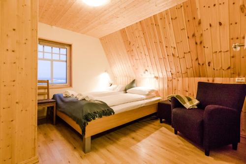 Postel nebo postele na pokoji v ubytování Holmvik Brygge Nyksund
