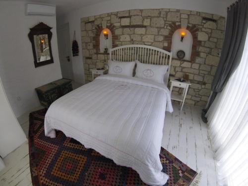 Postel nebo postele na pokoji v ubytování Morisi Konak Butik Otel