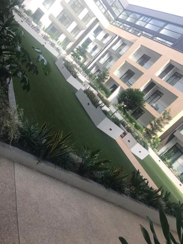 an aerial view of an apartment building with a green yard at A007 Embassy Gardens Studio Apartm in Accra