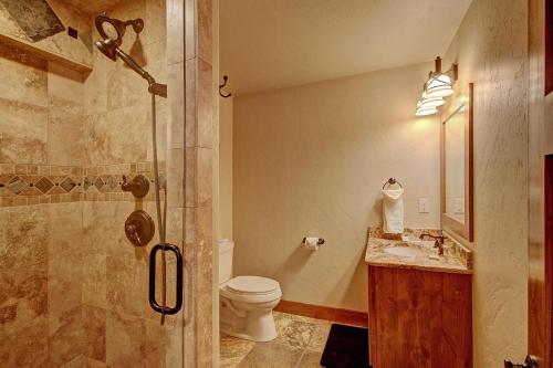 a bathroom with a shower and a toilet and a sink at Casa de Plata Home in Breckenridge