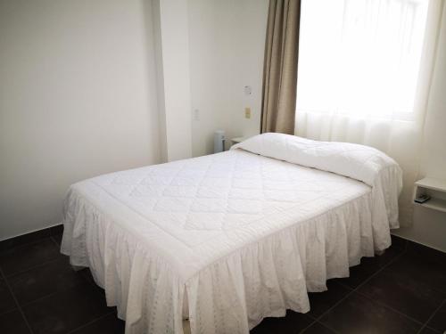 Ένα ή περισσότερα κρεβάτια σε δωμάτιο στο Coco Lodge Paracas