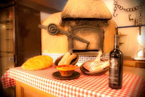 a bottle of wine sitting on top of a table with a table cloth at Hotel Santo Domingo de Silos in Santo Domingo de Silos