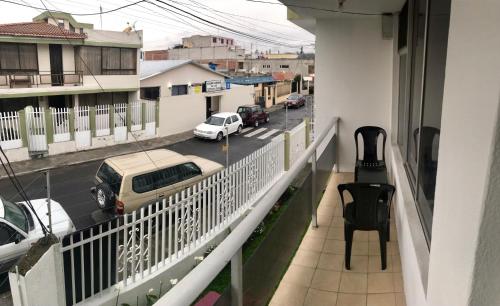a balcony with a view of a city street at Hostel Tierra de Fuego in Latacunga