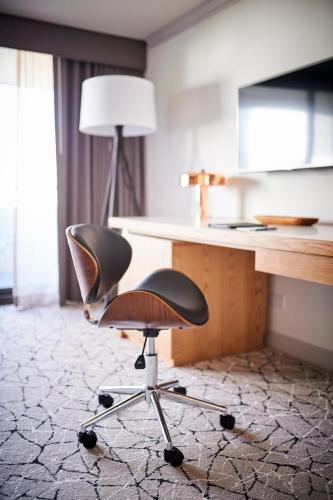 an office chair sitting in front of a desk at Warwick Denver in Denver
