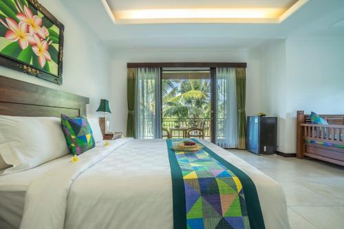 En eller flere senger på et rom på Gita Maha Ubud Hotel by Mahaputra-CHSE Certified