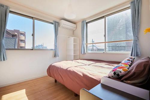 Voodi või voodid majutusasutuse koiwa house 3LDK free wifi free parking toas