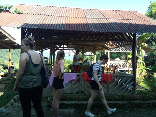a group of people standing in front of a gazebo at De Salak Homestay in Bogor