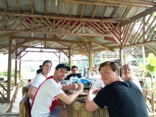 a group of people sitting at a table at De Salak Homestay in Bogor