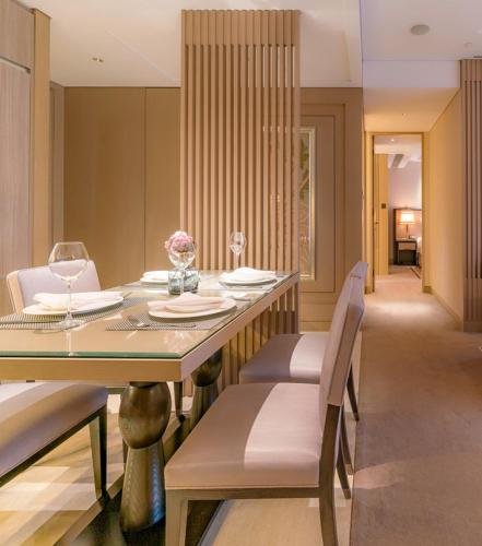 a dining room with a table and chairs at IFC Residence in Shanghai