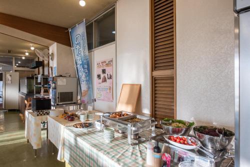 a buffet line with a table with food on it at Eboshiso in Tamagawa