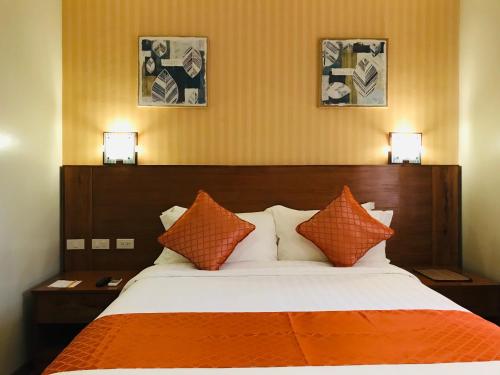 Postel nebo postele na pokoji v ubytování Coron Soleil Express Hotel