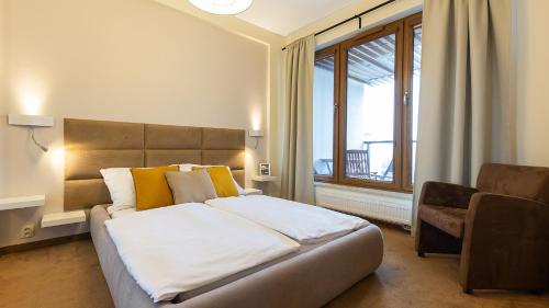 Posteľ alebo postele v izbe v ubytovaní VacationClub - Olympic Park Apartment A405