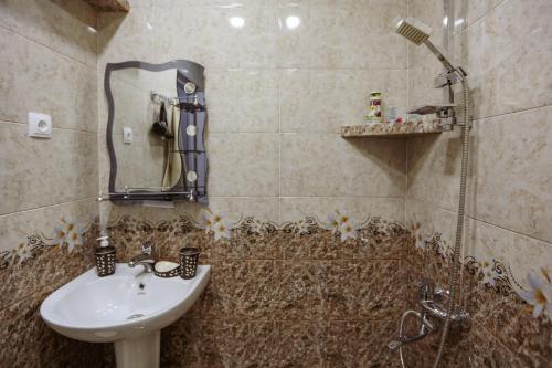 a bathroom with a sink and a shower at N&N House in Tbilisi City