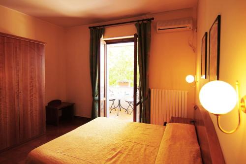 Postel nebo postele na pokoji v ubytování Hotel Boni Cerri
