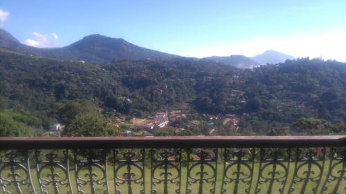 a view of the mountains from a balcony at Guest House Nosso Aconchego in Teresópolis