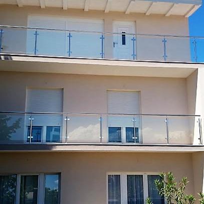 a building with balconies on the side of it at Apartments Nika's View in Vodice