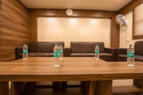 a group of water bottles sitting on top of a table at Elite Suites MINT Gomti Nagar in Lucknow