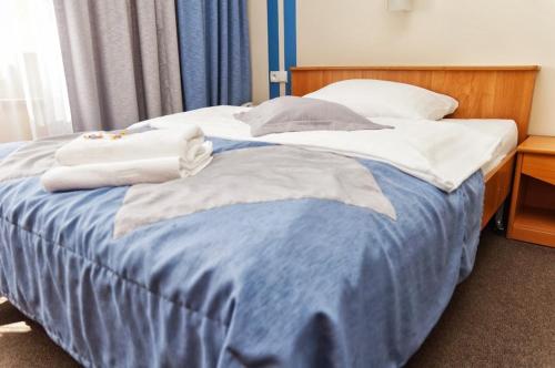 Ένα ή περισσότερα κρεβάτια σε δωμάτιο στο Vistula Hotel