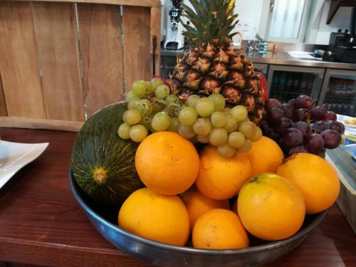 a bowl of fruit sitting on a table at Hotel Emblemático Holiday Time in Santa Cruz de la Palma