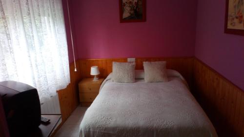 Cama o camas de una habitación en Hostal El Venero