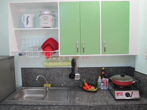 A kitchen or kitchenette at Cool Stay Inn